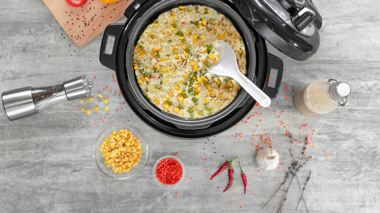 Rice and vegetables in pressure cooker