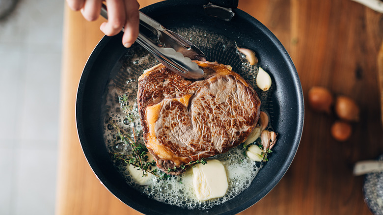 Seared meat in pan