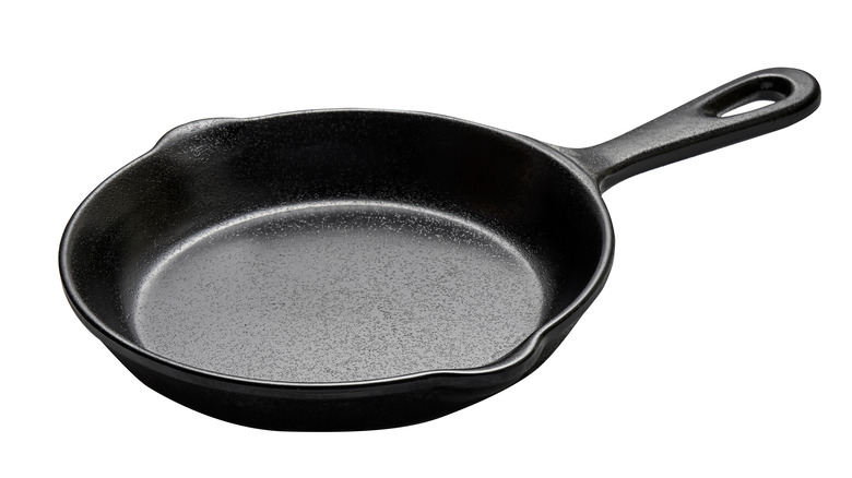 Cast iron skillet on white background