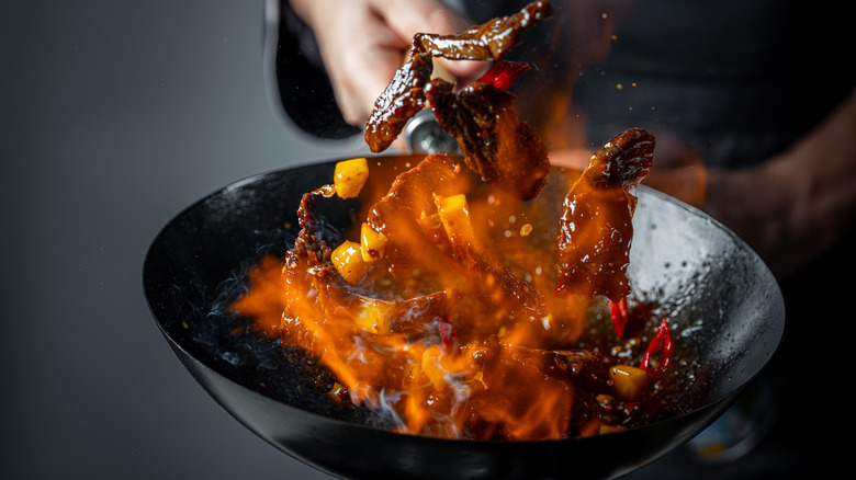 Chef using a wok