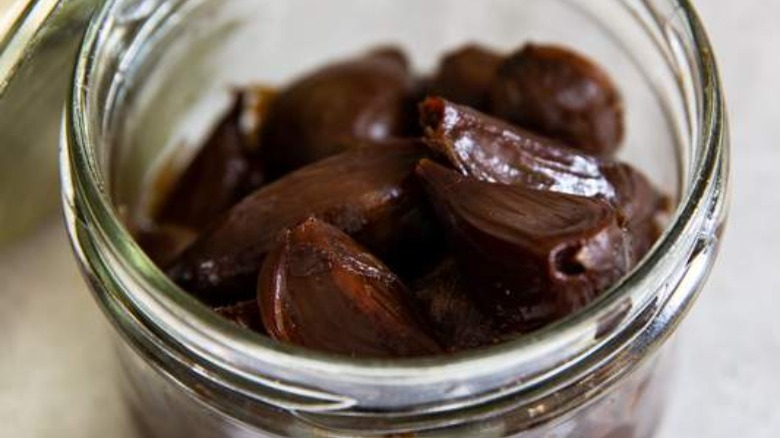 Jar of black garlic confit 