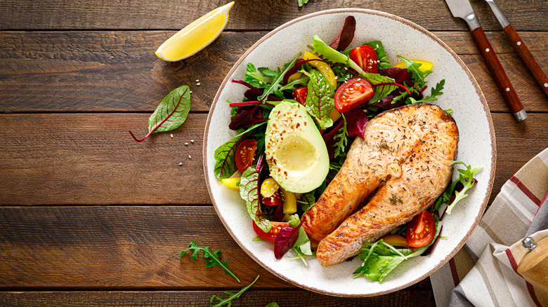 Salmon steak with salad