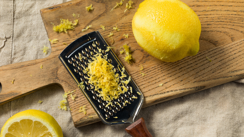 A microplane zesting a lemon 