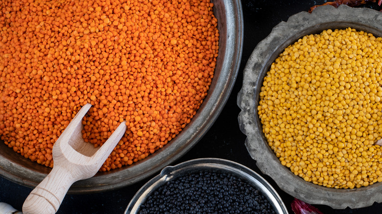 Raw lentils in bowls