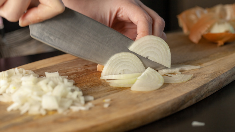 cook chopping onions