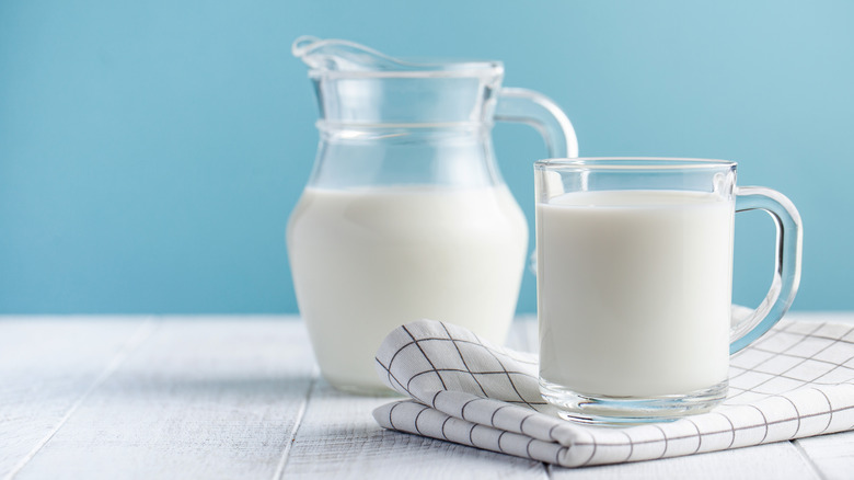 Pitcher and cup of milk