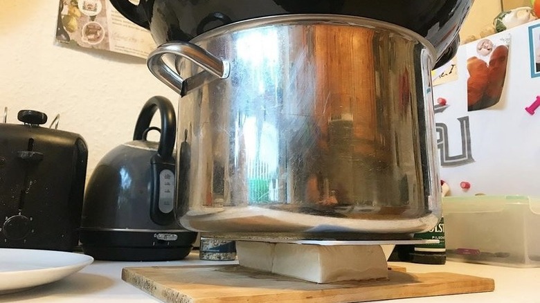 Tofu pressing under pot