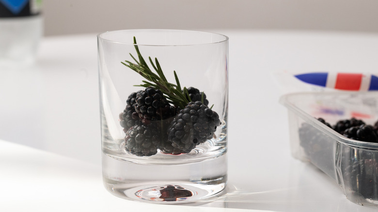Cocktail glass with blackberries 