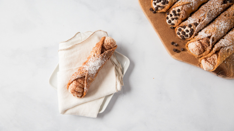 cannoli displayed on marble table