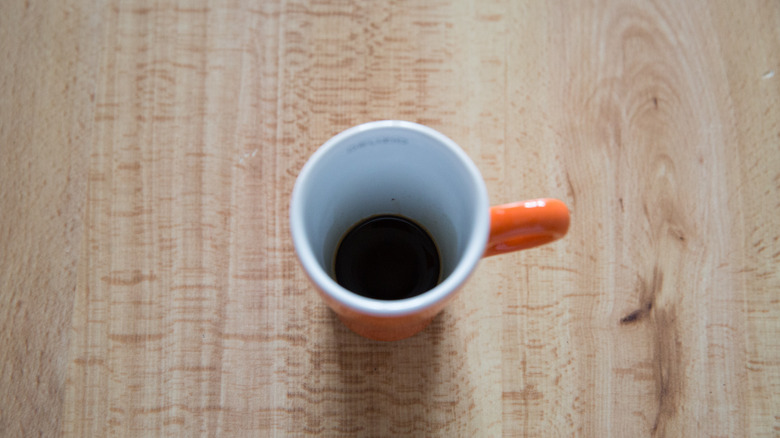 small espresso on wooden table