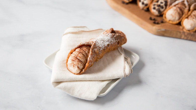 tiramisu cannoli on marble table
