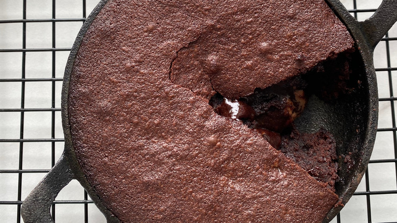 Skillet brownie with slice cut out of center