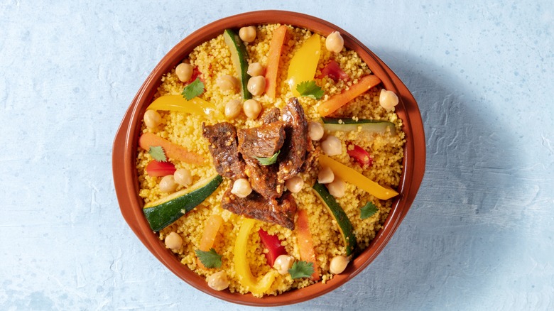 Couscous with chickpeas, meat, and peppers
