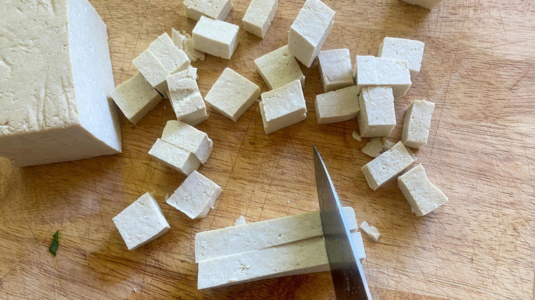 chopping tofu with knife