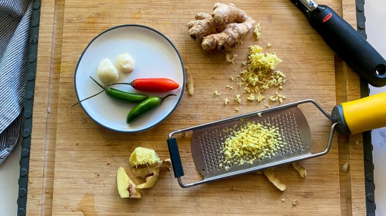 ginger and microplane on cutting board