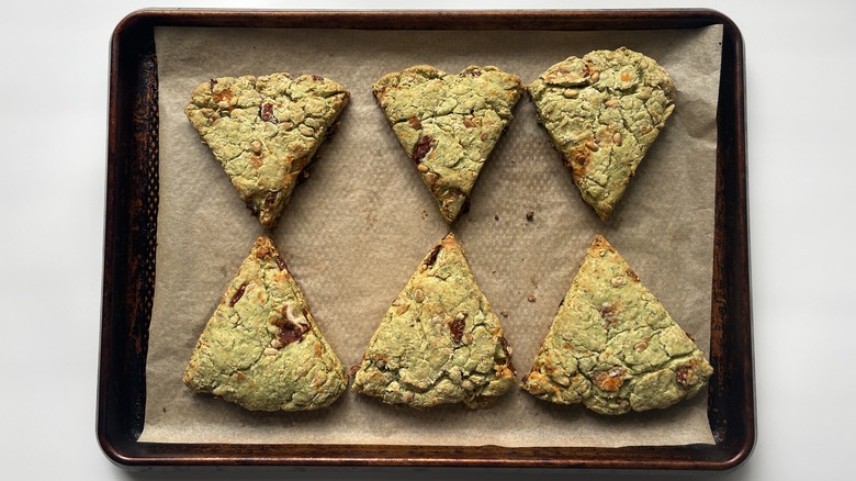 triangular greenish-brown scones in pan