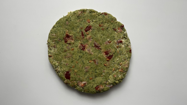 flat round of green dough