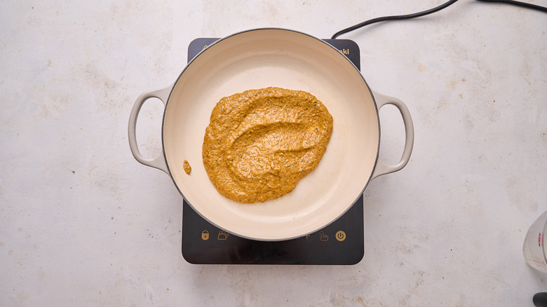 simmering pesto in skillet