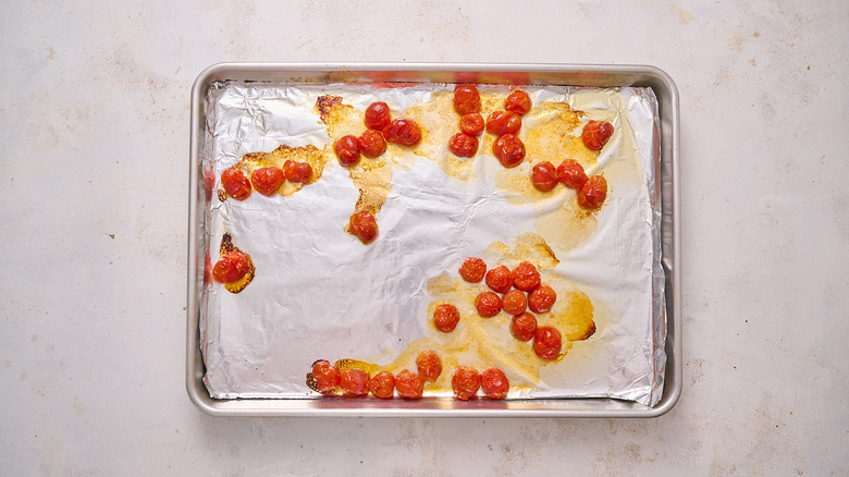 roasted tomatoes on sheet tray