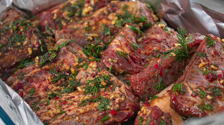 Meat marinating with herbs