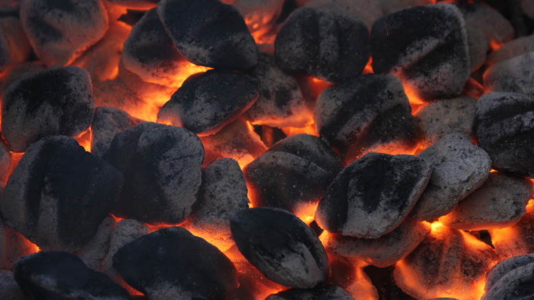 Charcoal briquettes on a barbecue