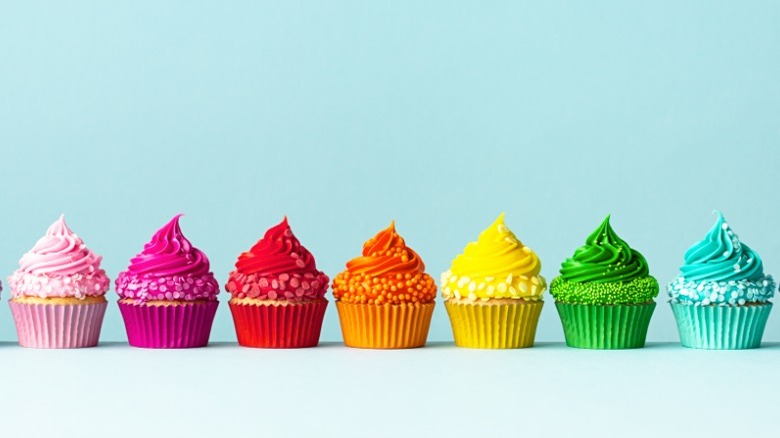 Row of rainbow cupcakes