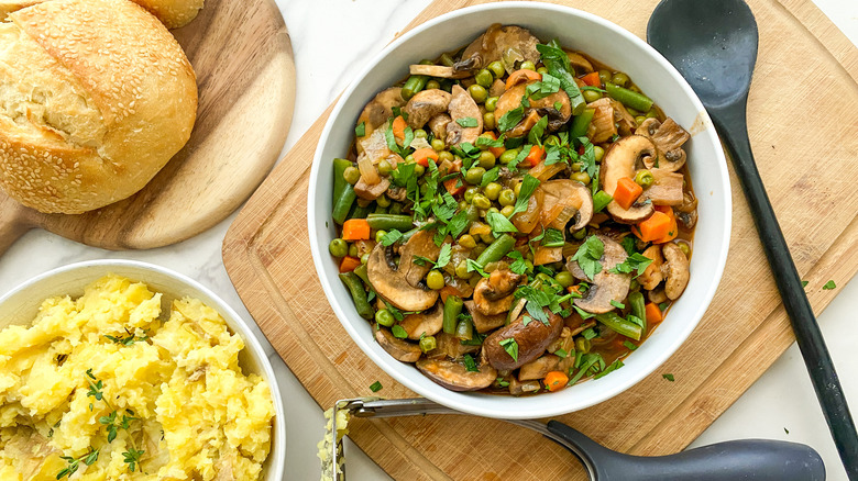 Bowl of mushroom stew and bowl of mashed potatoes