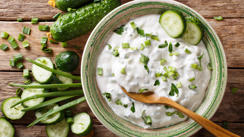 A bowl of tzaziki sauce with cucumber