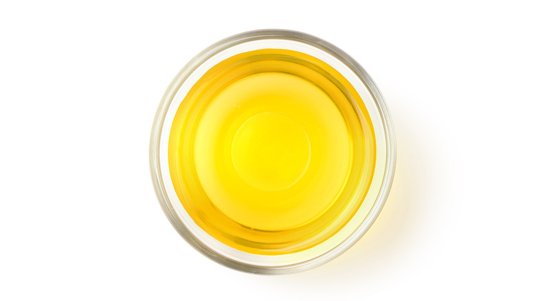 Glass cup of vegetable oil