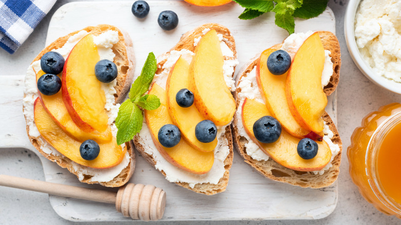 Peach toasts with cheese and blueberries