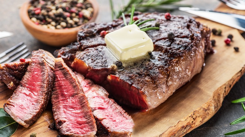 Steak with butter, herbs, and spices