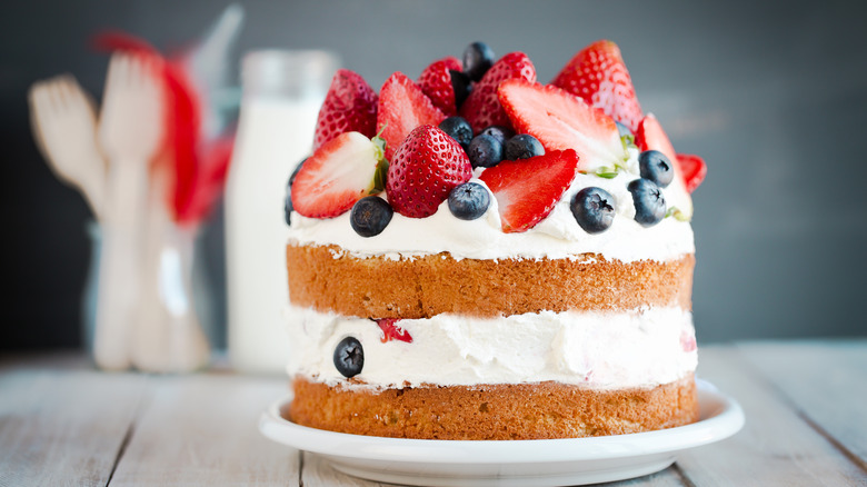 cake with frosting and berries