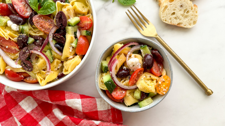 small bowl of salad with gold fork