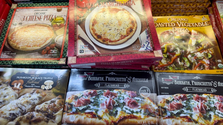 stacks of trader joe's pizzas