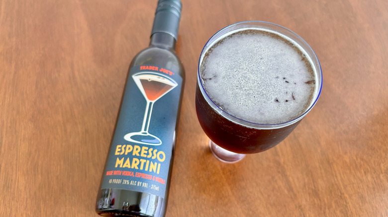 Trader Joe's espresso martini bottle next to espresso martini in glass