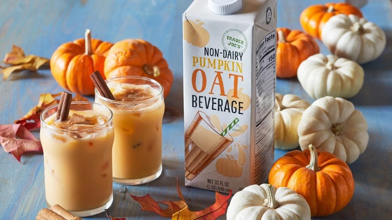 Glasses of coffee next to pumpkin oat beverage carton