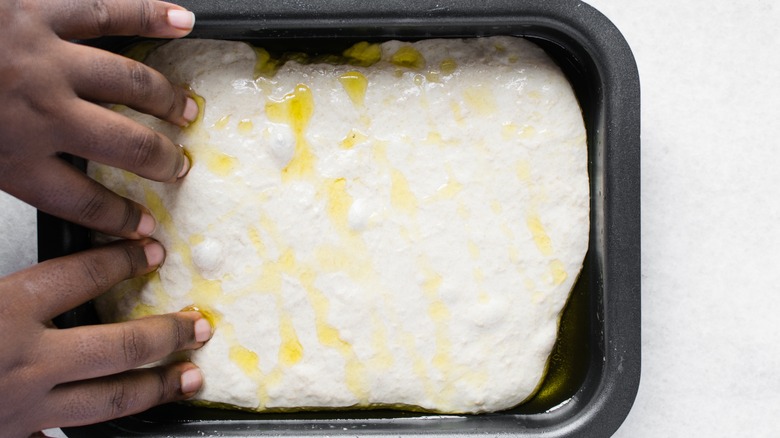 dimpling focaccia dough