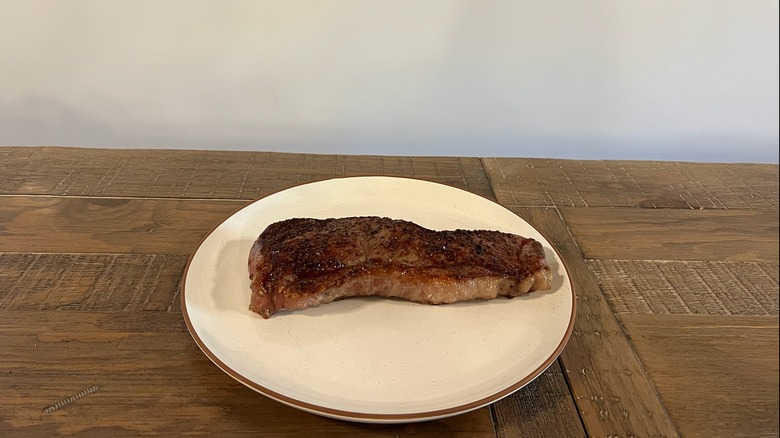 Trader Joe's NY strip steak cooked on plate