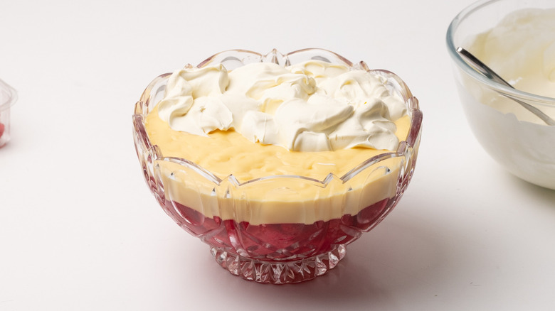 topping trifle with whipped cream