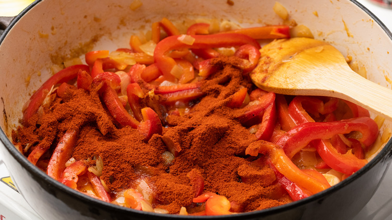 peppers, onion, and paprika in pan