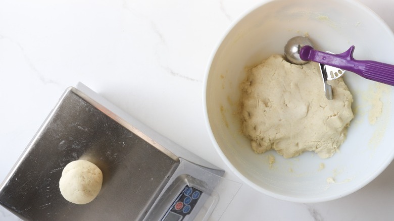 Portioning dough with scoop