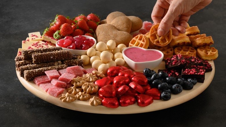 candy and cookies on charcuterie board