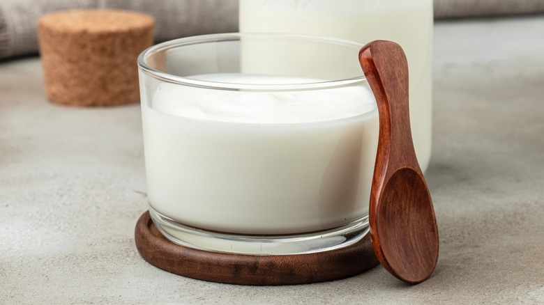 Homemade buttermilk in a glass and carafe