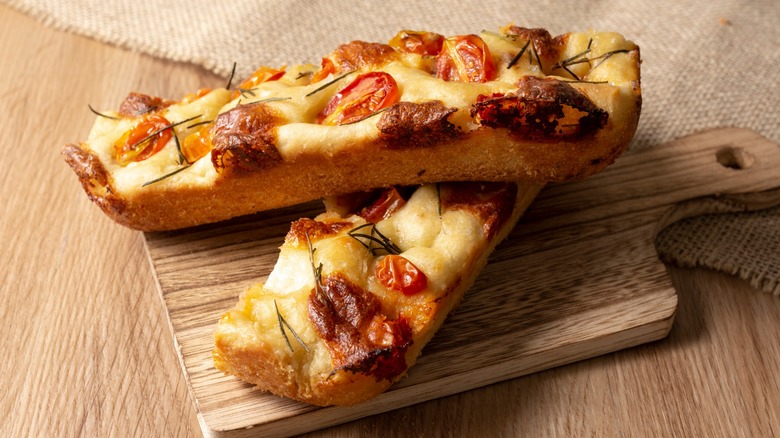 Garlic bread pizza on a wooden board