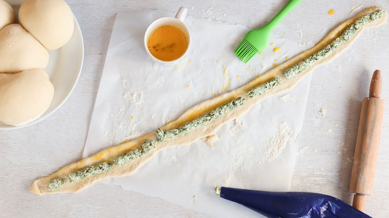 preparing stuffed pretzel roll