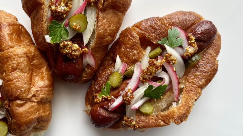 croissant hot dogs with toppings