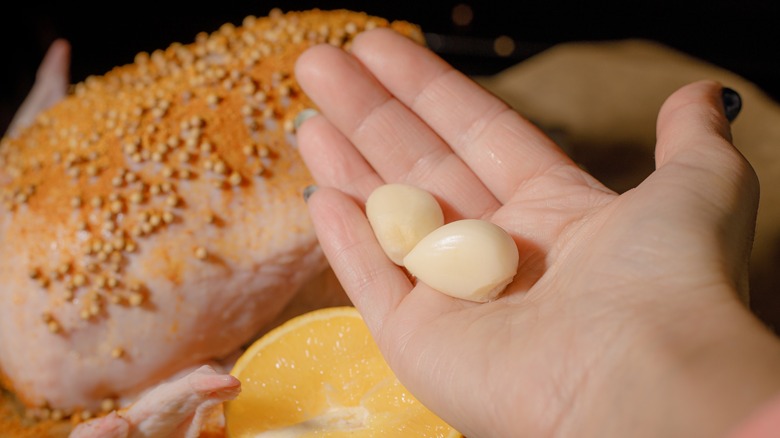 Peeled garlic in hand