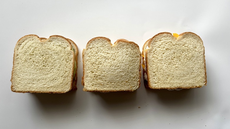 three sandwiches on white bread