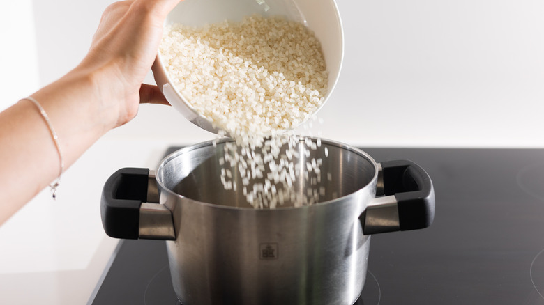 rice going into pot 