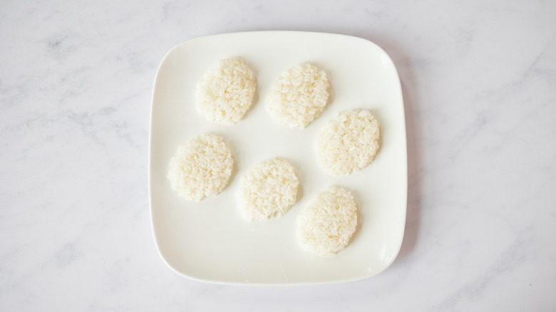 rice in skull shapes on plate 